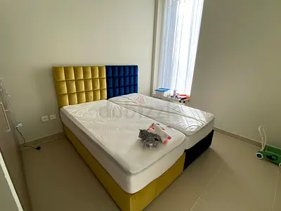Pair of upholstered single beds with mattresses - can be joined as double