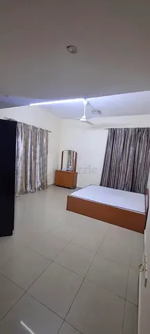 Furnished master bedroom with attached bathroom and balcony