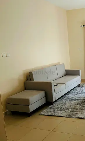 Light grey 3-seater sofa with ottoman - good condition