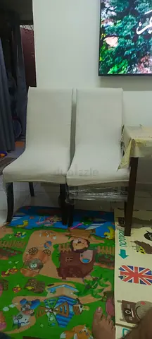 Set of 4 dining chairs in cream fabric — used, good condition. One for 30. 4 for 120