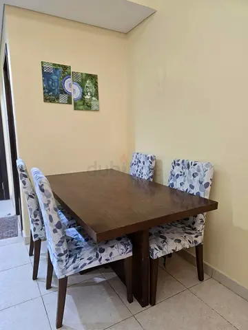 Solid Wood Dining Table with 4 Upholstered Chairs - Good Condition