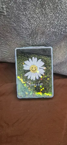 Small foldable makeup mirror with daisy artwork - collectible and vintage