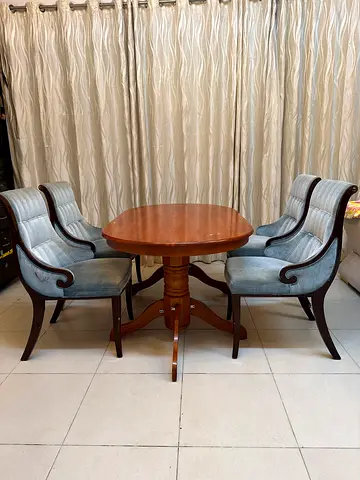 Wooden table with four matching upholstered armchairs