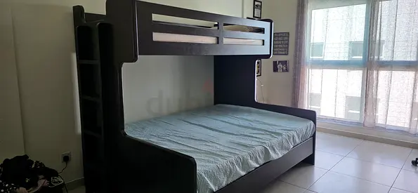 Solid wooden bunk bed with ladder - good condition