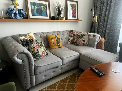 Light grey tufted 3-seater sofa with chaise (Good condition)