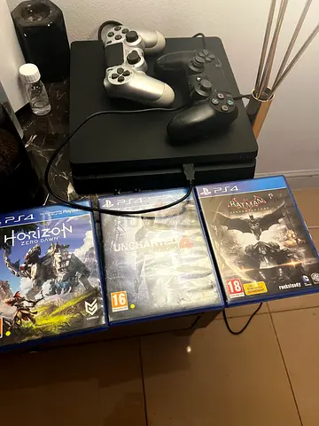 PlayStation 4 Slim with 2 Controllers + 3 Games (Horizon, Uncharted, Batman) - Good Condition