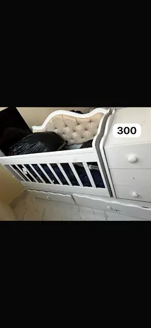 White baby crib with attached drawers - good condition