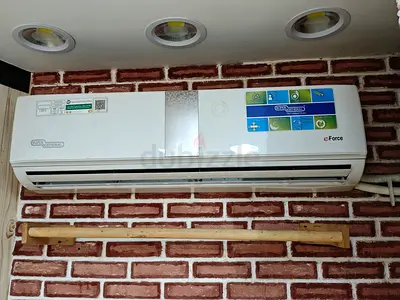Super General eForce split air conditioner with a white finish and a central silver accent panel