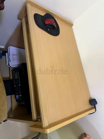 Compact light-wood computer desk with sliding keyboard tray