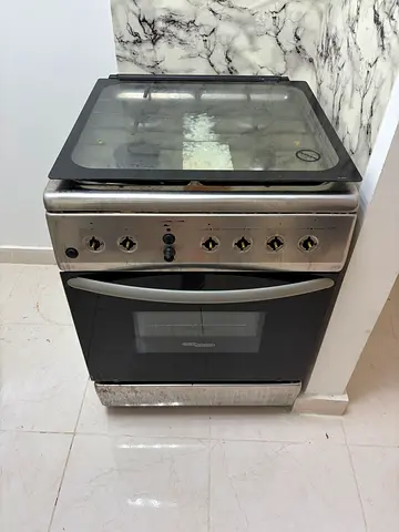 Used freestanding stainless steel gas oven and hob with gas cylinder