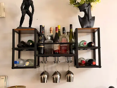Wall-mounted industrial wine rack with glass holders