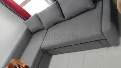 L-shaped grey fabric sofa Bed- good condition