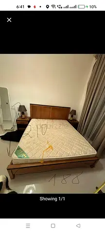 Wooden king size bed frame with mattress and two bedside tables