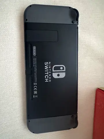 Nintendo Switch (black) with 3 games - excellent condition with screen protector and carrying case.