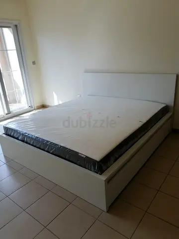 ikea malm king bed with ikea firm mattress   having 2 storage units under the bed