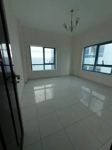 Available for rent in Al Khan Corniche a spacious apartment featuring 2 bedrooms a separate living room 2 bathrooms and a balcony. Located in a prime