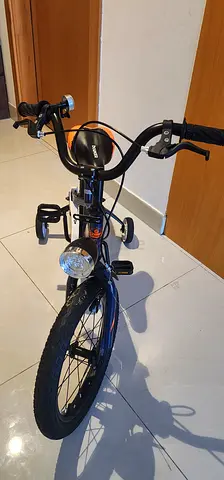 Used kids/teen cruiser bike in good condition with lights and basket mount