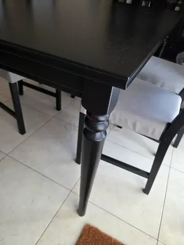 Extendable Solid dark wood dining table without chairs - good condition.