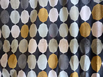Grey geometric patterned area rug with gold accents - good condition