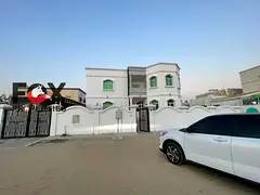 Commercial villa for rent in Al Rawda 1 on a main road, 4,700 sq.ft., 6 bedrooms, majlis, large hall