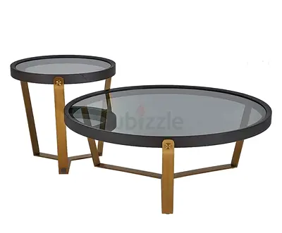 Anarka Coffee Table Set. Featuring a sleek black frame, brushed gold metal legs, and tempered glass