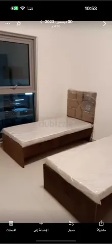 Two single wooden beds with mattresses - good condition