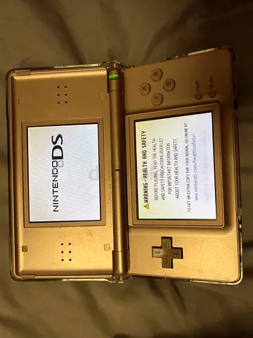 Pink Nintendo DS Lite in working condition ( authentic non modded )includes chargerProtective case