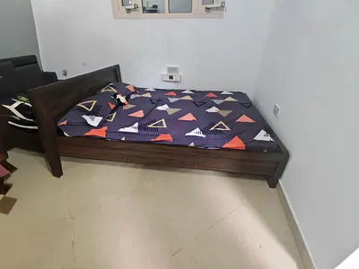 Queen size bed with mattress for 275AED.