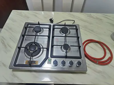 4-burner stainless steel gas hob with cast iron grates and hose - used
