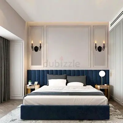 King-size upholstered bed with navy velvet headboard