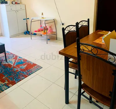 Wooden dining table with 4 metal-frame chairs - good condition