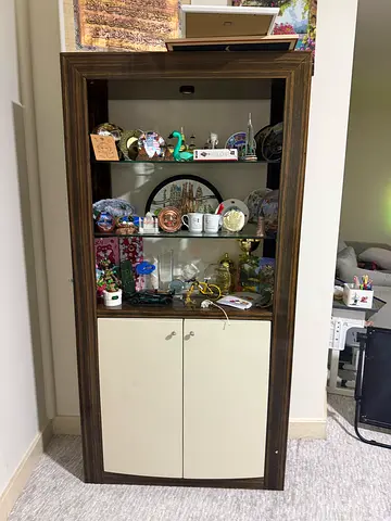 Wooden display cabinet with glass shelves and storage cupboard