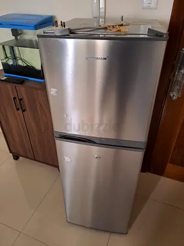 Silver double-door refrigerator with freezer - used, good working condition
