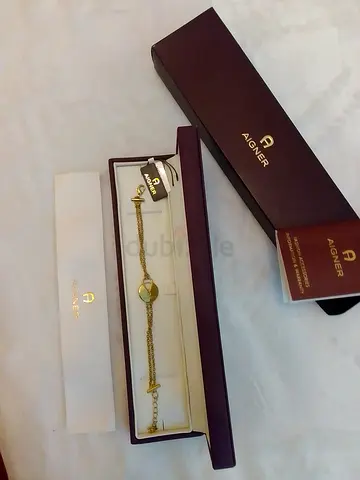 Genuine Aigner gold plated bracelet with tags and box