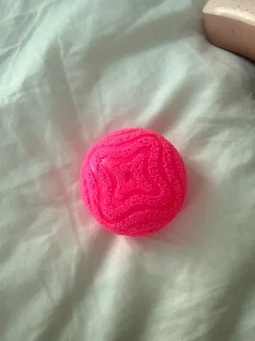 Small textured pink sensory squishy ball - gently used