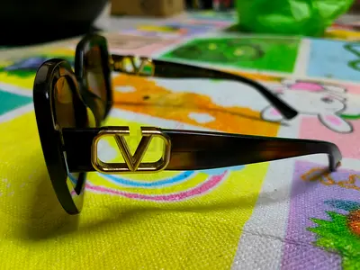Brand valentino woman Brown designer-style sunglasses with gold  — gently used