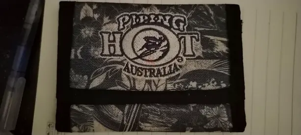 Piping Hot Australia black fabric wallet — compact tri-fold