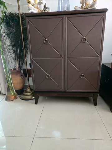 Brown wooden Bar Counter with double doors and ample storage space for bottles and glasses