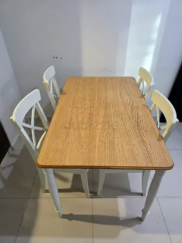 Small wooden dining table with 4 white chairs - compact set