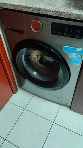 Silver front-load washing machine - good working condition