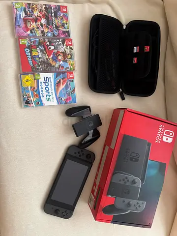 Nintendo Switch (black) with 3 games - excellent condition with screen protector and carrying case.