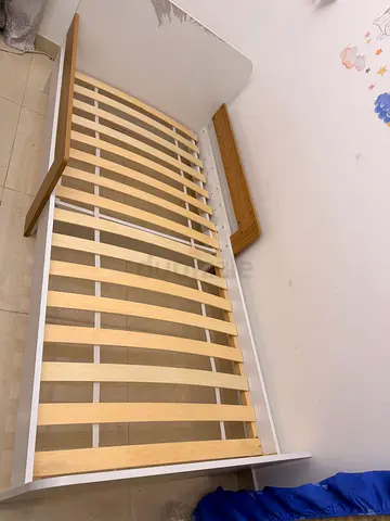 Convertible baby crib / toddler bed frame - white with natural wood accents