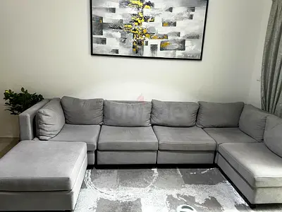 Light grey L-shaped sectional sofa in great condition.