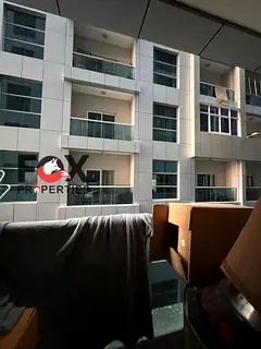 2BR apartment for sale in City Tower Ajman, 1,240 sqft, balcony, parking, excellent condition. Price