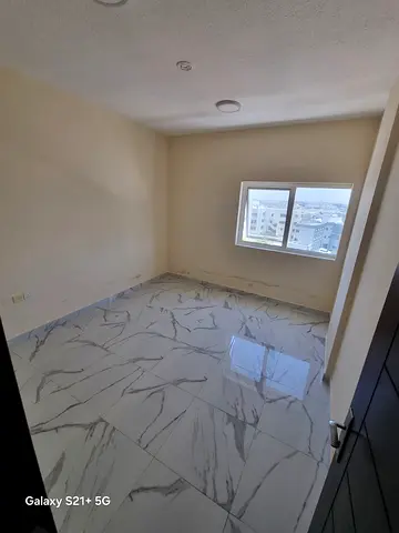 Annual Apartment for Rent in Al Bu Tina, Sharjah A stylish one-bedroom apartment with a spacious living room, modern finishing, and an excellent layo