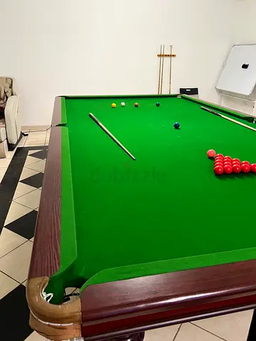 Full-size snooker table with cues and balls - good condition