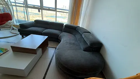 Large curved grey fabric sectional sofa - good condition