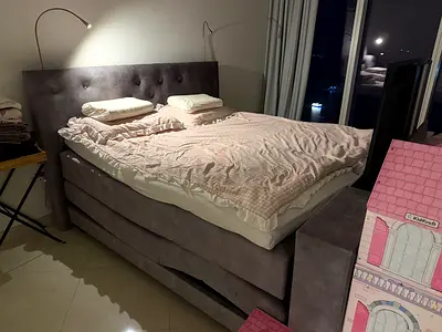 Grey upholstered double bed with storage - good condition