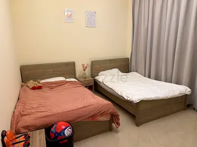 Matching Set of Twin Size Beds with Wood Finish