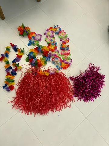 Set of Hawaiian party leis and hula skirts (used)